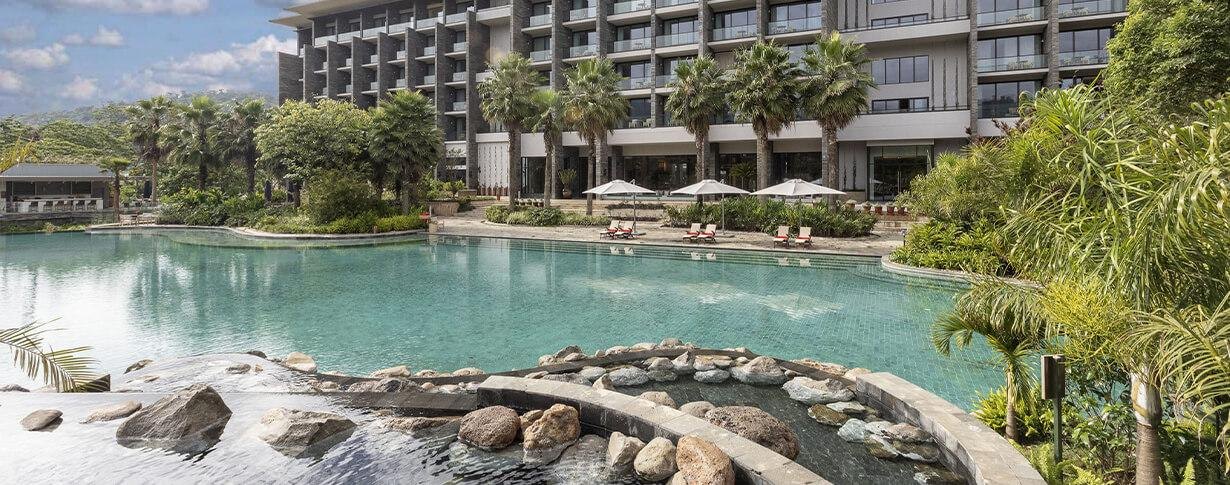 Gran Meliá Arusha — Pool and garden-facing hotel exterior